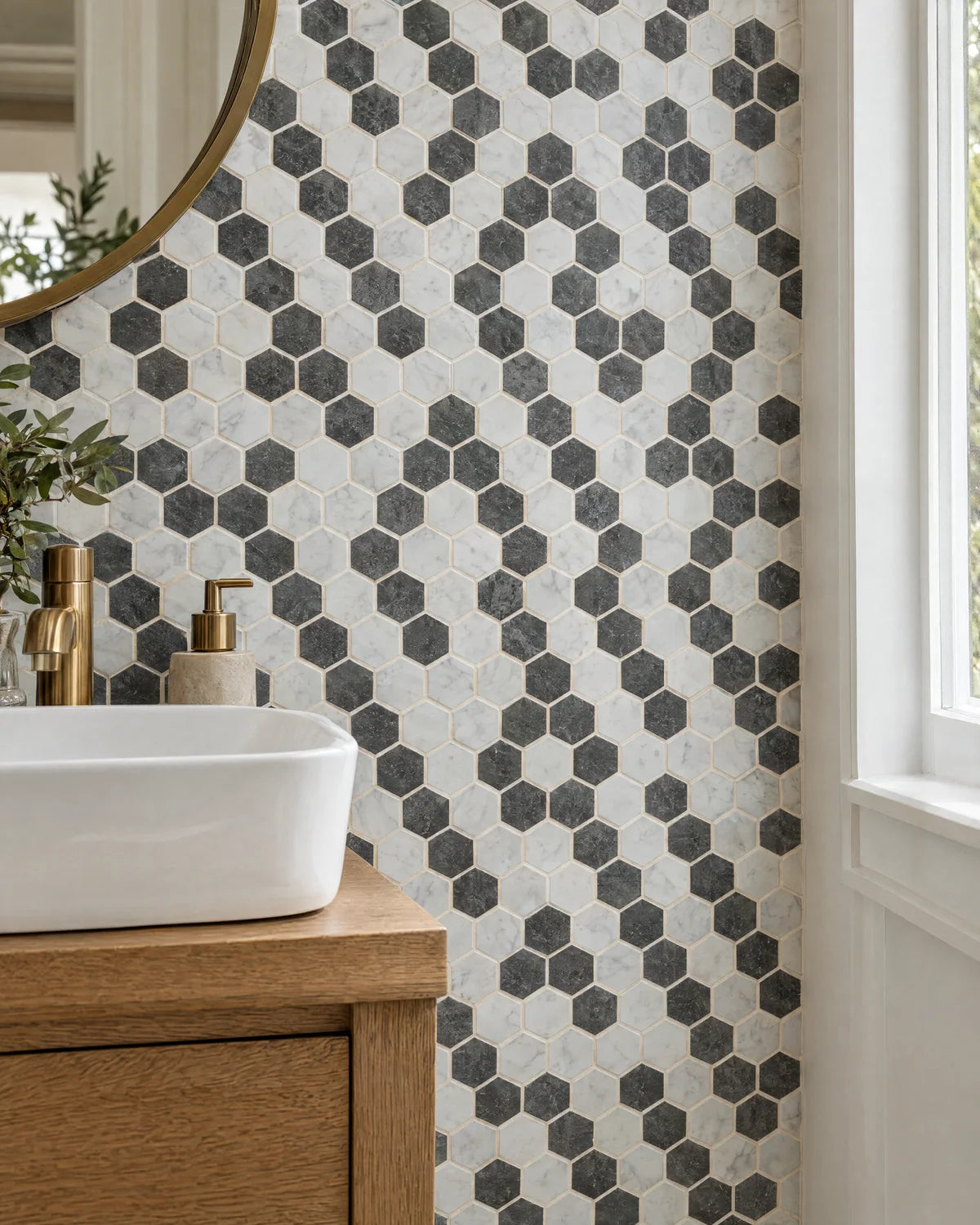 White and charcoal hexagonal mosaic tile in a powder room